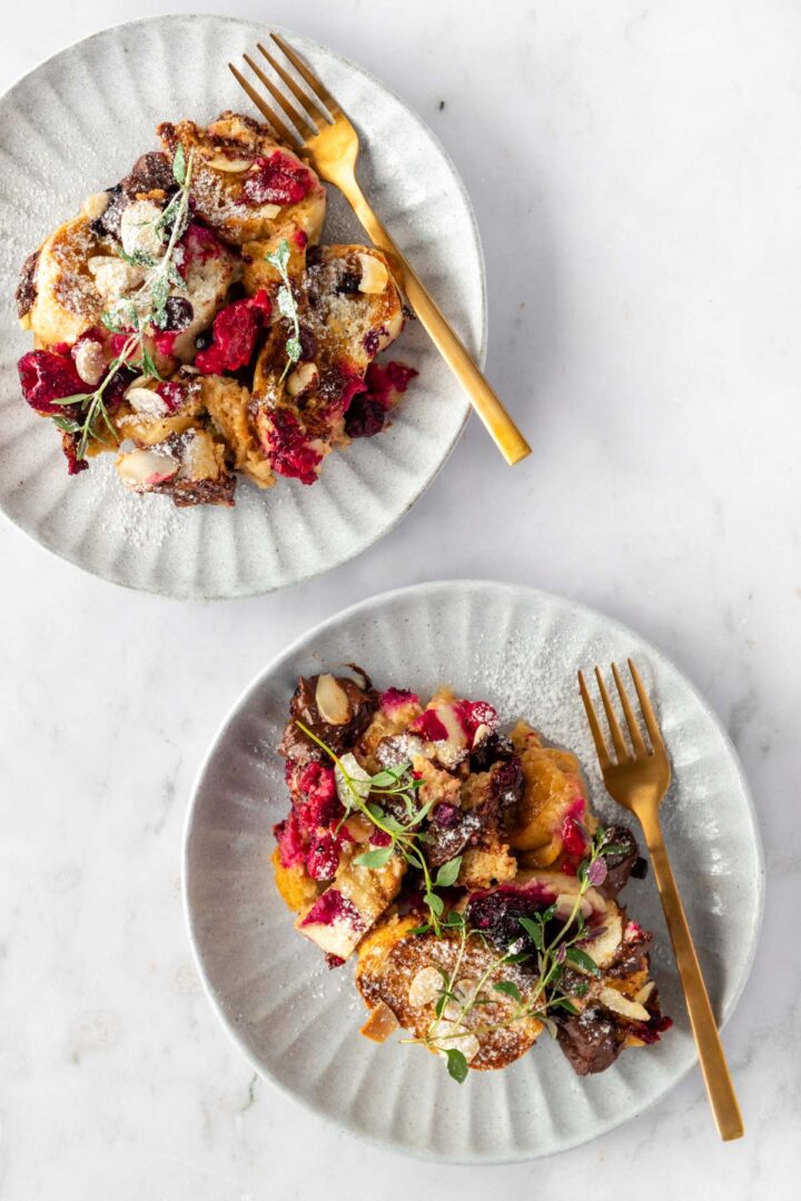 two small plates served with french toast and two gold forks