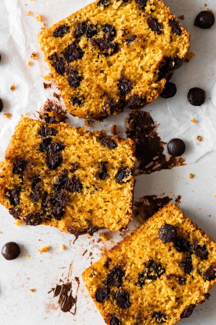 close up of three slices of chocolate chip pumpkin bread