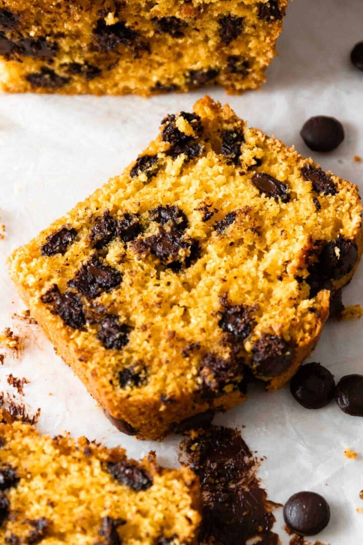 close up of a slice of pumpkin bread with chocolate chips