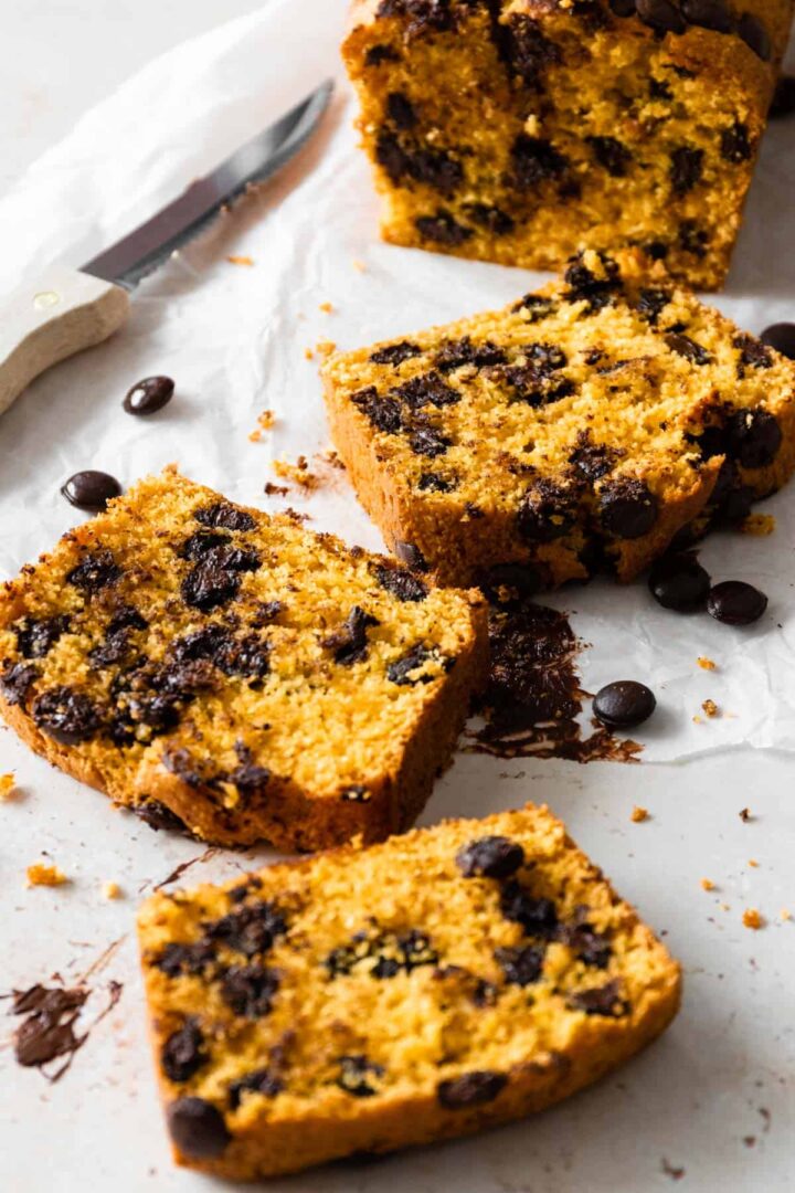 slices of chocolate chip pumpkin bread and a knife on the side