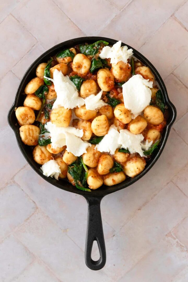 baked gnocchi with mozzarella cheese on top before going to the oven