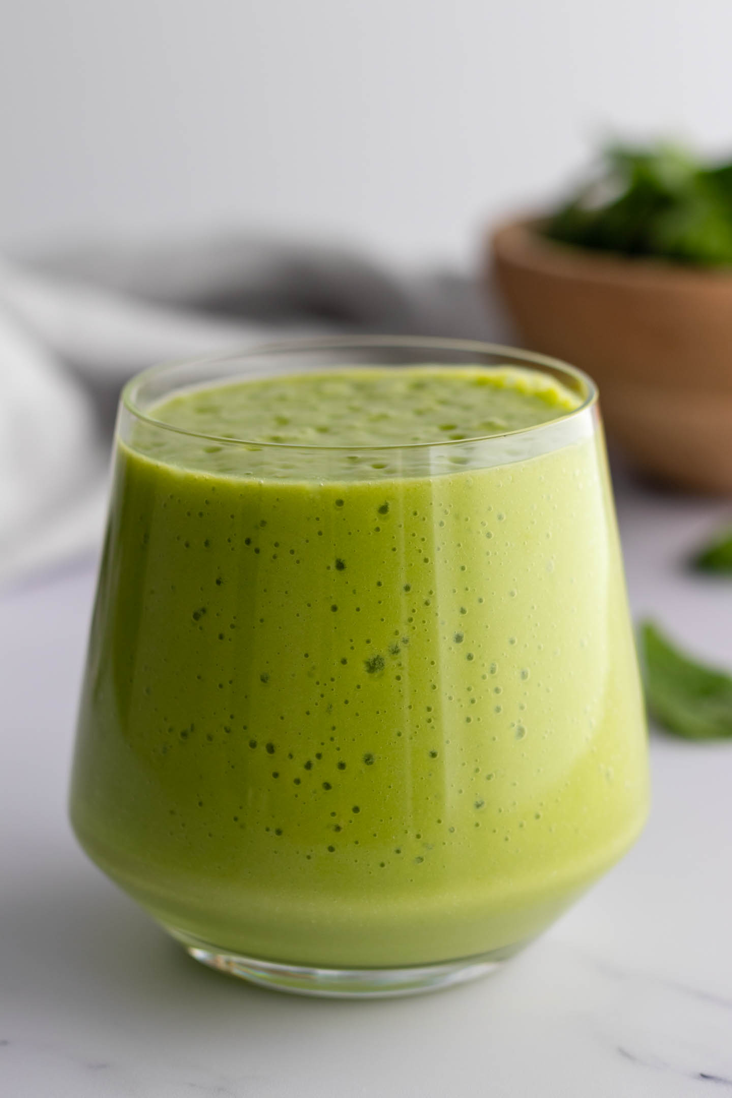 a glass with green smoothie