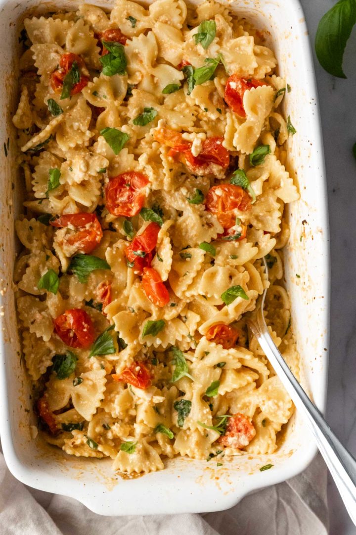 close-up of baked feta pasta with chopped basil on top