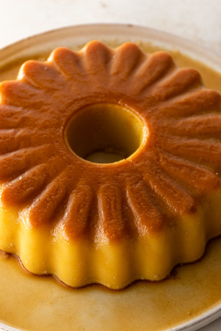 close up of a coconut flan with caramel on top