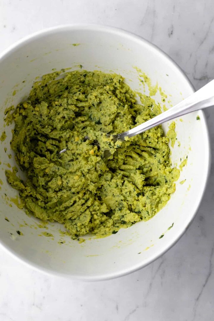 avocado dip mixed on a large bowl with a fork