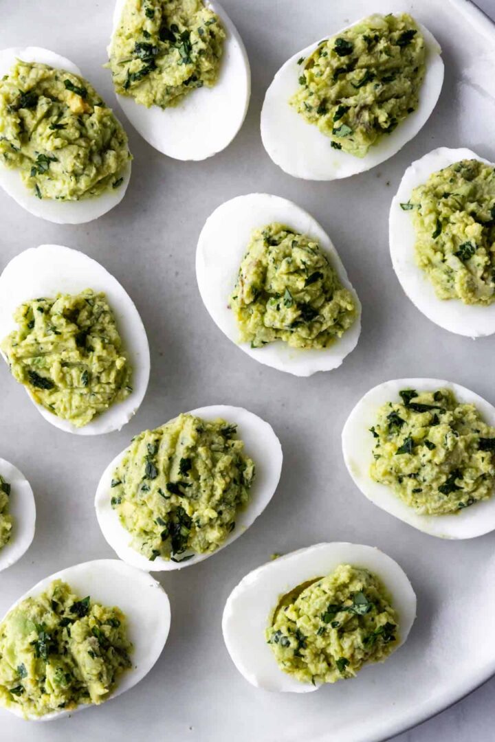 egg halves filled with avocado dip