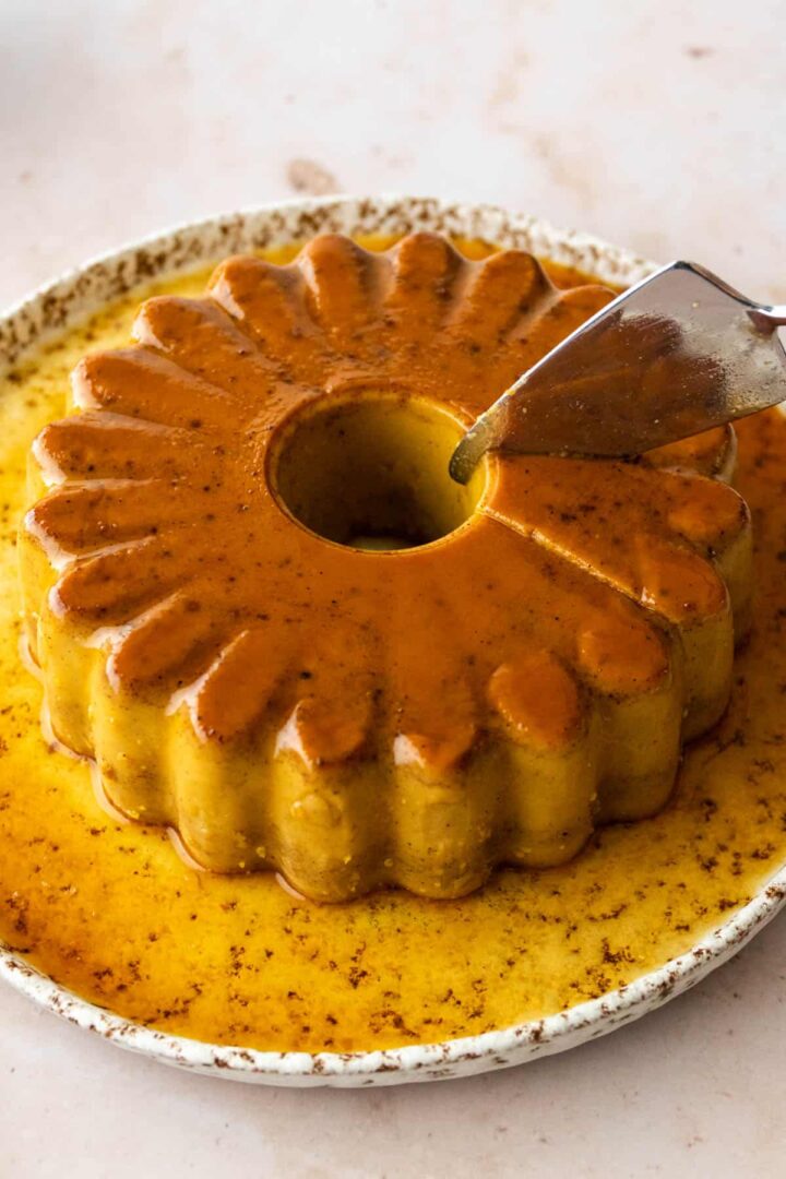 a pumpkin spice flan being served