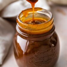 A glass jar with pumpkin spice syrup