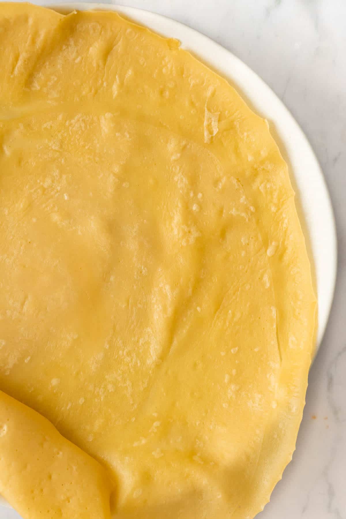 one plain crepe on a plate